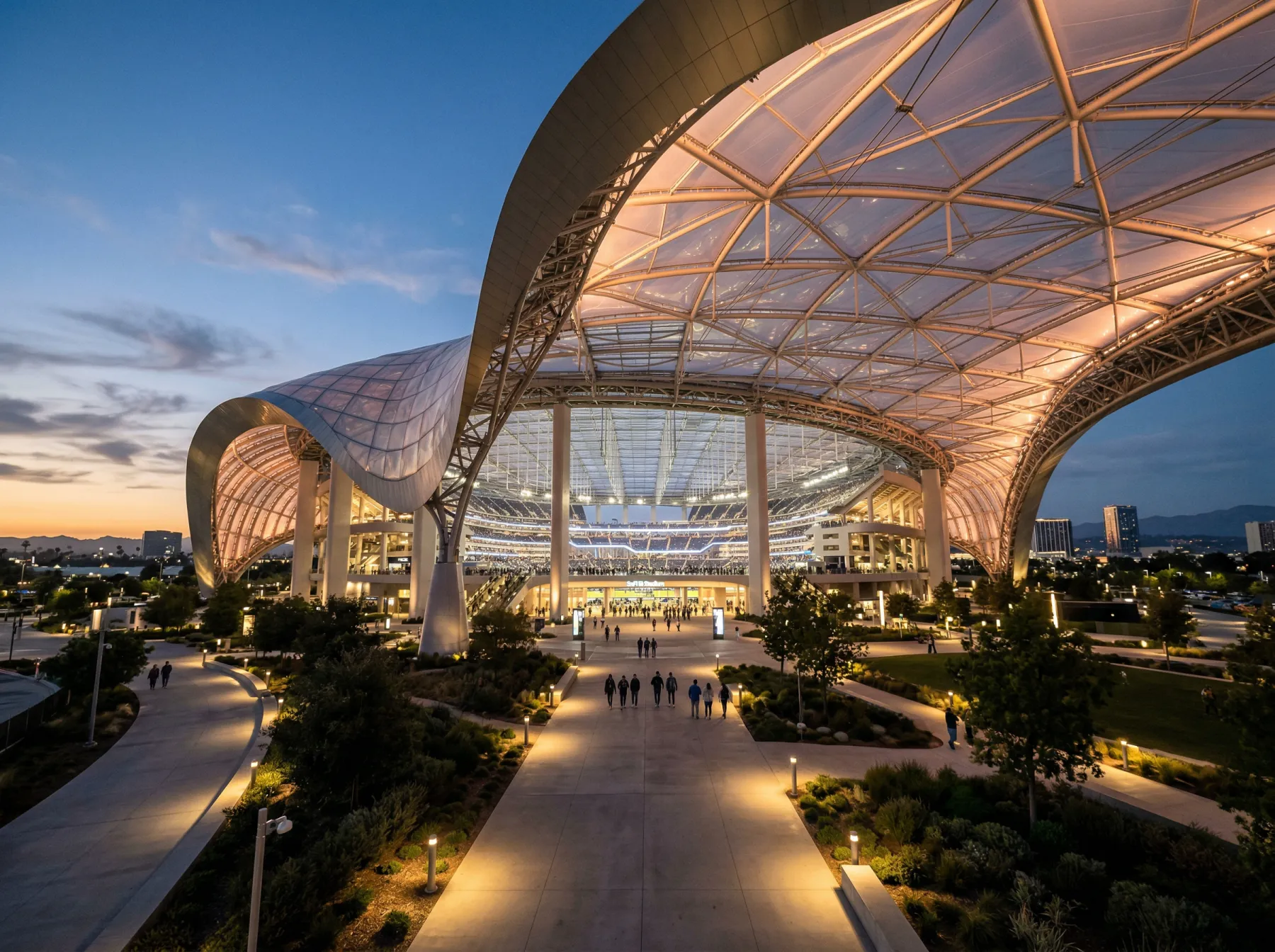 SoFi Stadium in Inglewood Los Angeles with its translucent canopy roof and modern exterior at dusk