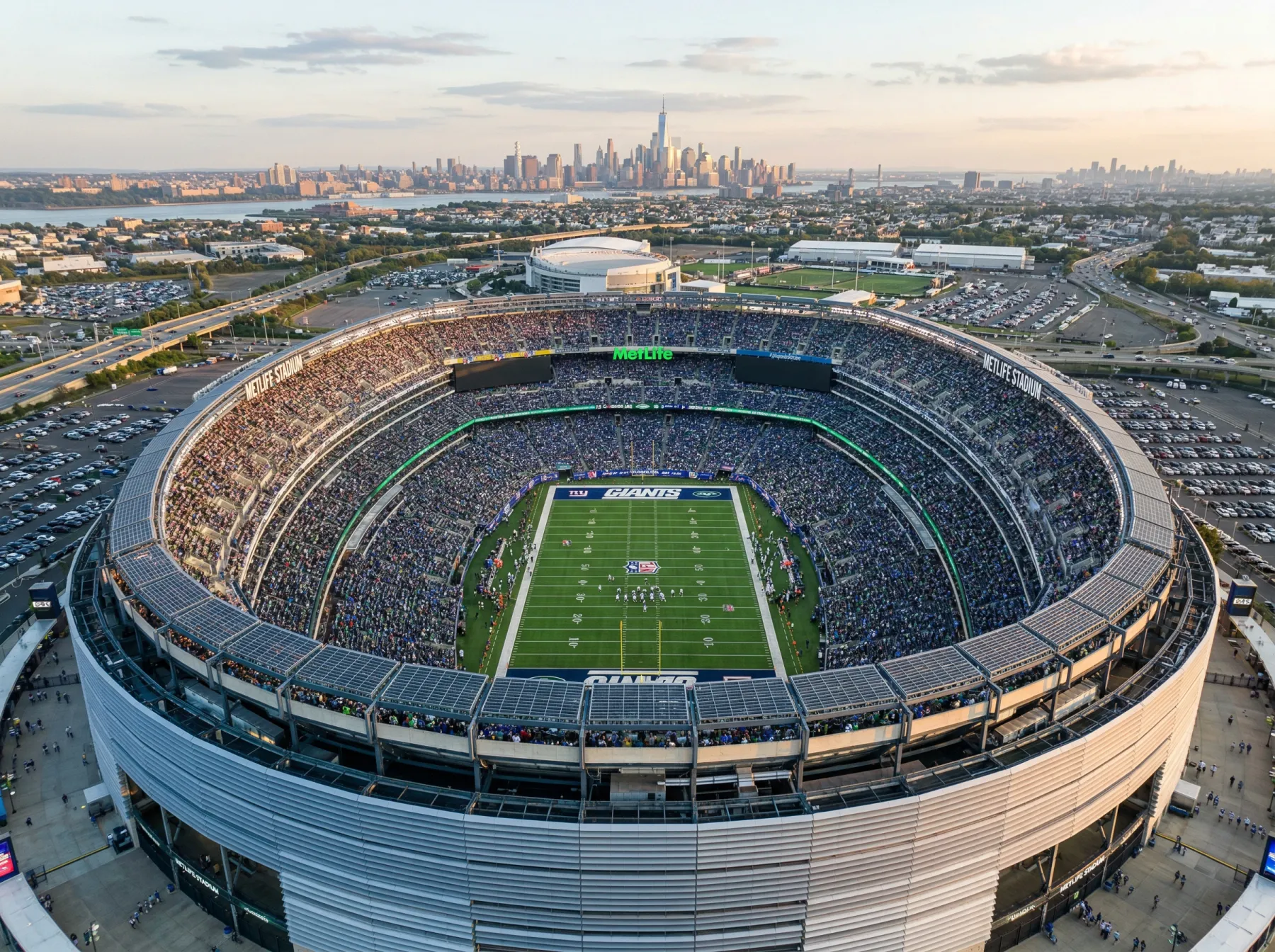 Aerial view of MetLife Stadium in New Jersey set up for the 2026 World Cup Final with football pitch markings and tournament branding visible